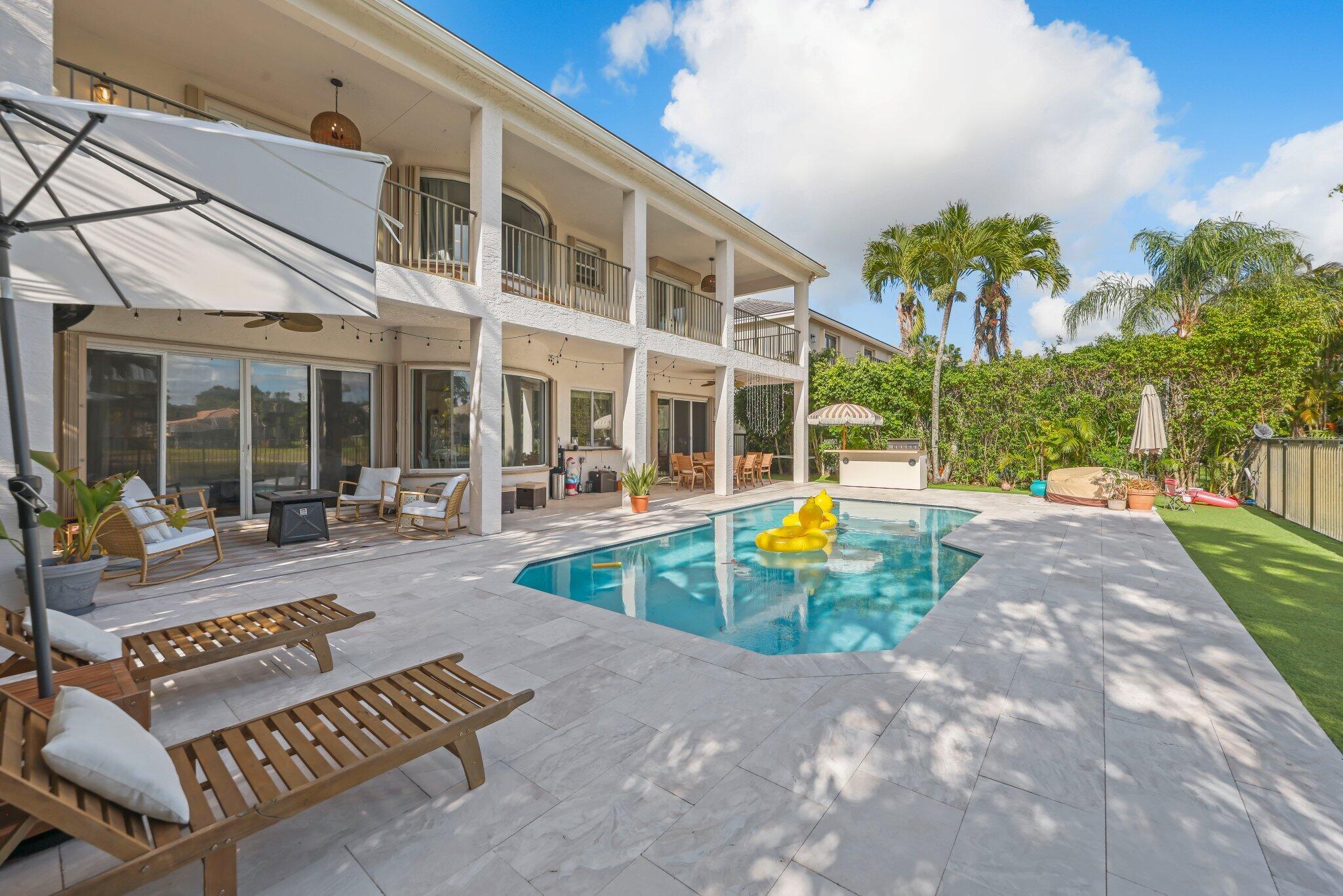 19650 Estuary Drive Boca Raton, FL 33498 - Photo 32 of 83 a view of outdoor space yard swimming pool and seating