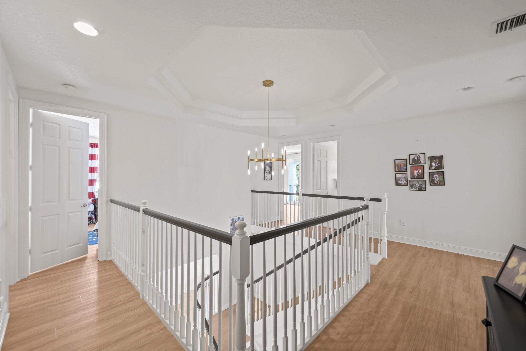 19650 Estuary Drive Boca Raton, FL 33498 - Photo 40 of 83 a view of a hallway view with wooden floor and windows