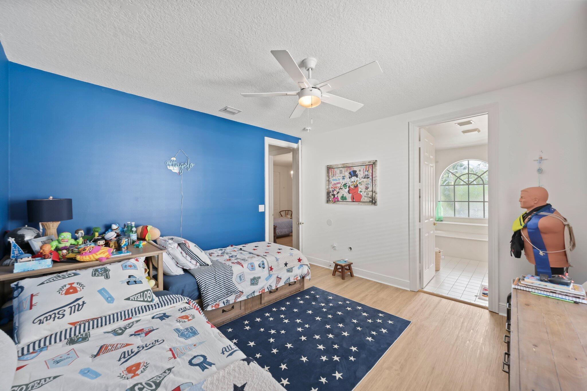19650 Estuary Drive Boca Raton, FL 33498 - Photo 43 of 83 a bedroom with two beds and a window