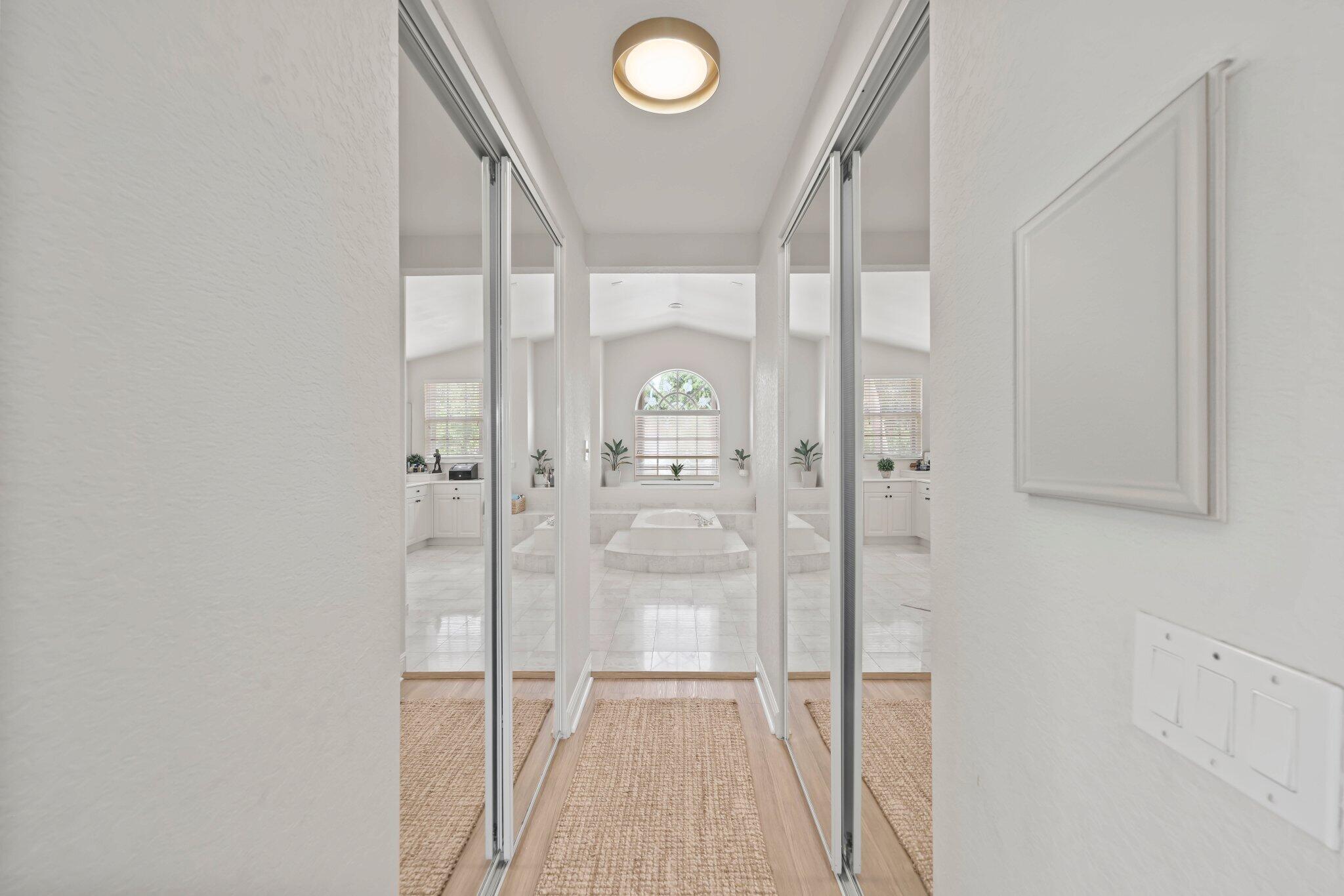 19650 Estuary Drive Boca Raton, FL 33498 - Photo 57 of 83 a bathroom with a glass shower door and a glass door