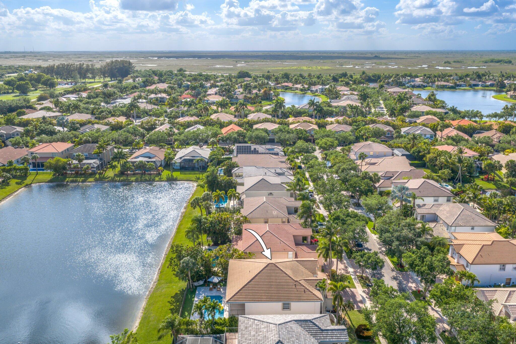 19650 Estuary Drive Boca Raton, FL 33498 - Photo 71 of 83 an aerial view of residential houses with outdoor space and lake view