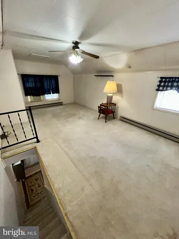 a view of a livingroom with furniture and chandelier