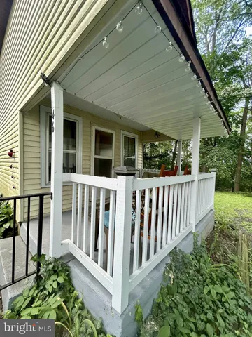 a view of a wooden house with a backyard