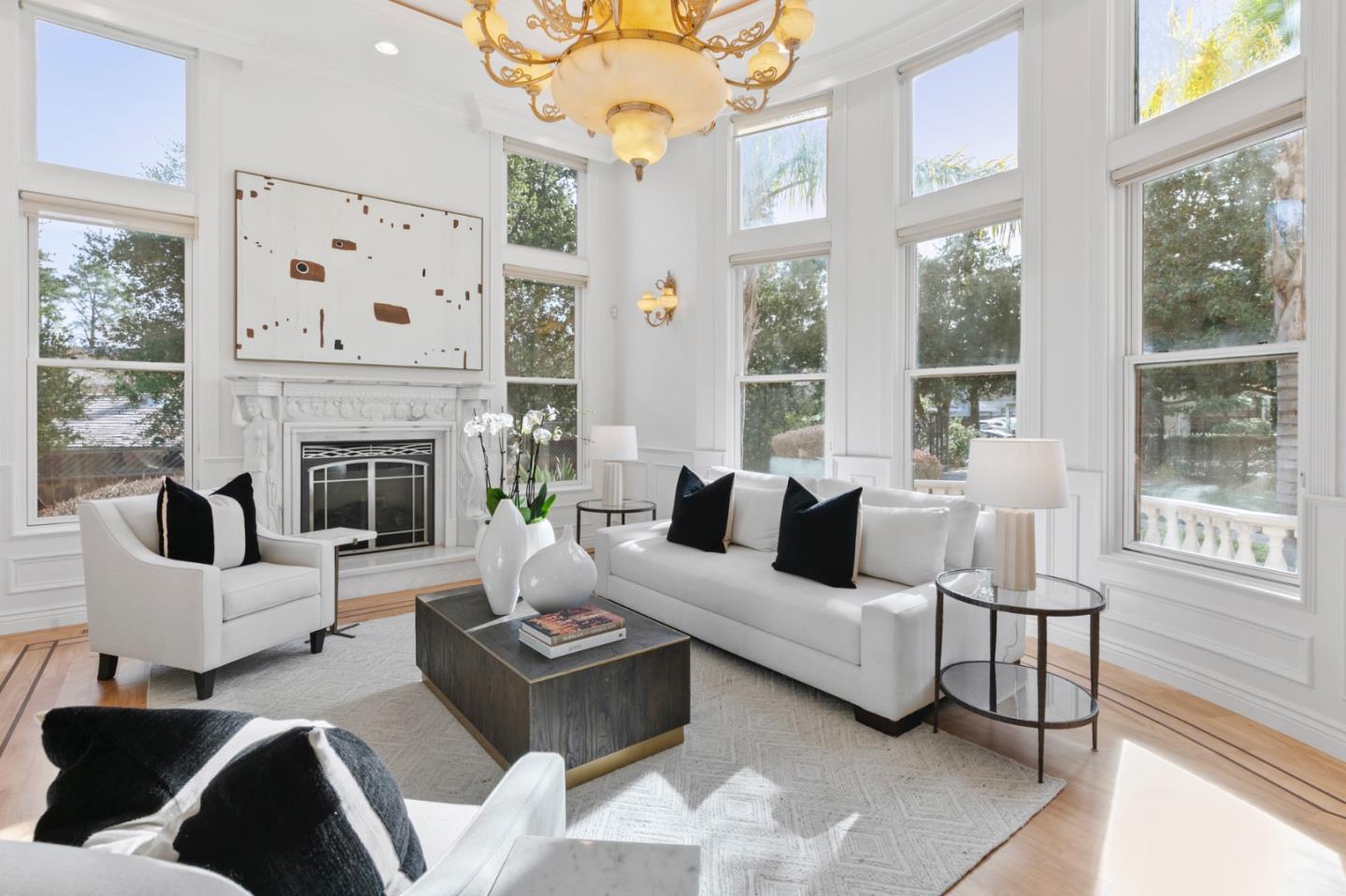 779 Mora Drive Los Altos, CA 94024 - Photo 12 of 81 a living room with furniture large window and a fireplace