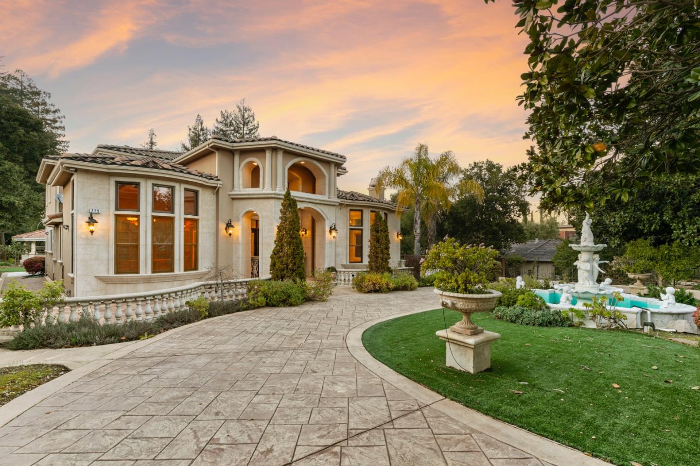 779 Mora Drive Los Altos, CA 94024 - Photo 3 of 81 a front view of a house with a yard table and chairs