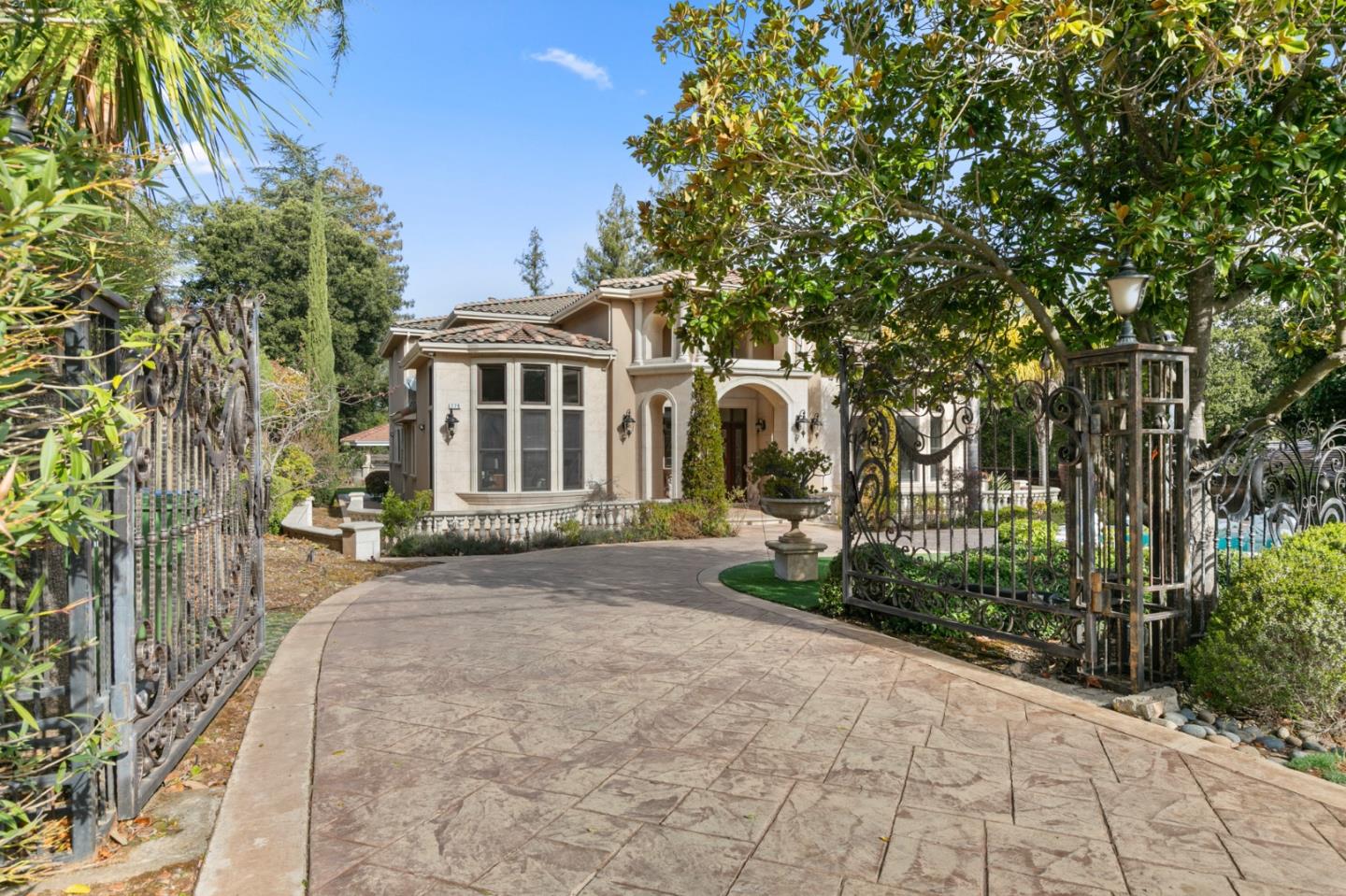 779 Mora Drive Los Altos, CA 94024 - Photo 75 of 81 a view of a house with a yard and potted plants