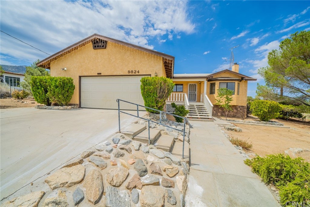 9824 Mountain Road Pinon Hills, CA 92372 - Photo 1 of 1 a view of outdoor space yard and front view of a house