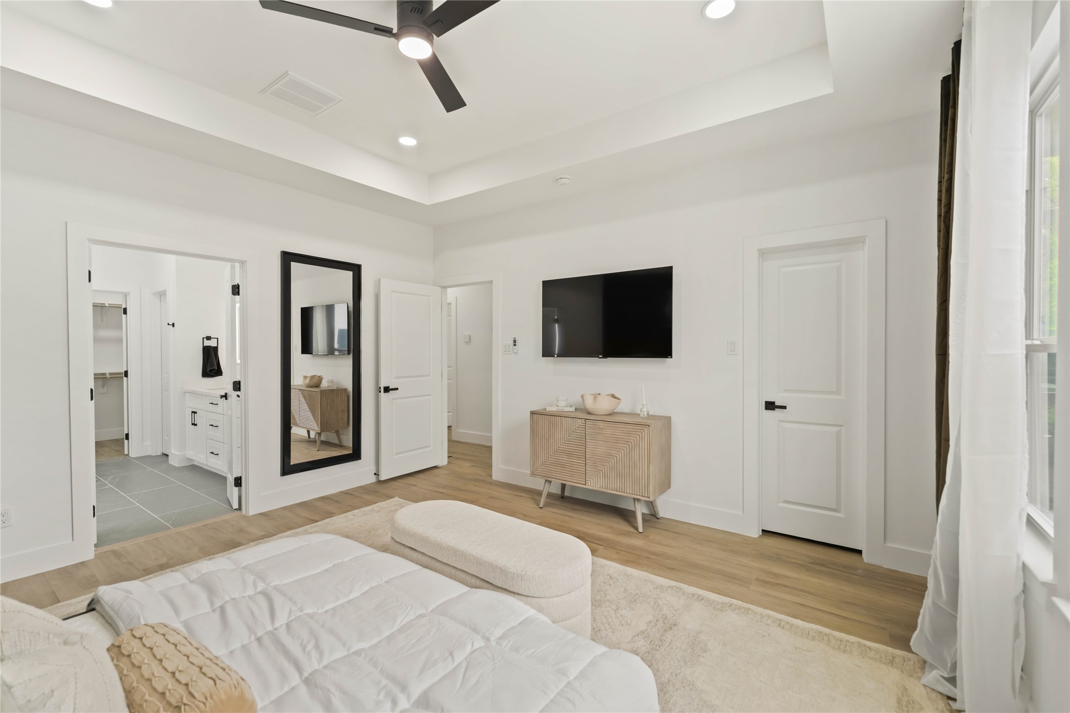 6539 Sealey Street Houston, TX 77091 - Photo 16 of 28 a bedroom with a bed and a flat screen tv