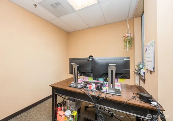 a view of a workspace with furniture