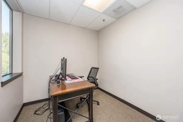 a view of a workspace with furniture
