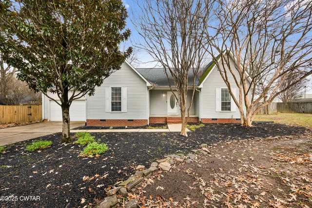 a house with a tree in the background