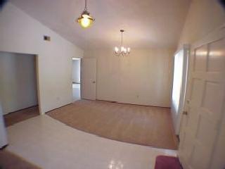 5500 Country Club Drive Rohnert Park, CA 94928 - Photo 3 of 9 an empty room with chandelier fan and windows