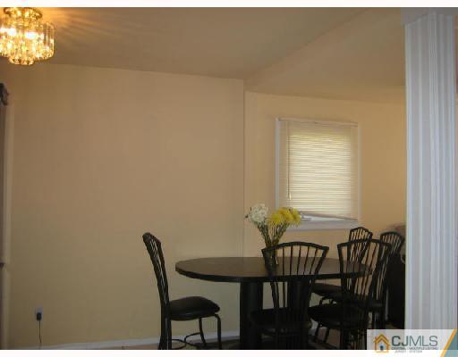 14 New Dover Road Iselin, NJ 08830 - Photo 4 of 10 a view of a dining room with furniture and window