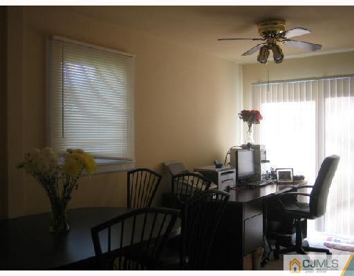 14 New Dover Road Iselin, NJ 08830 - Photo 5 of 10 a view of a dining room with furniture and a chandelier