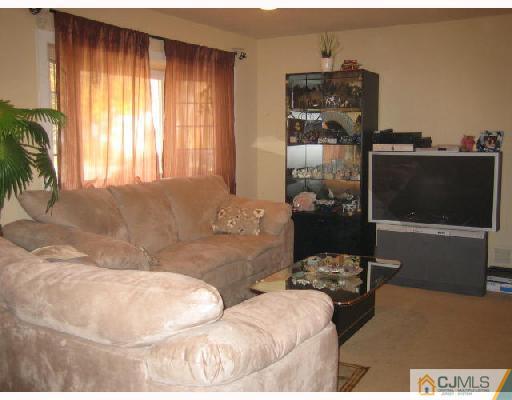 14 New Dover Road Iselin, NJ 08830 - Photo 7 of 10 a living room with furniture and a flat screen tv