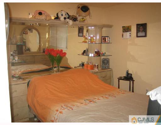14 New Dover Road Iselin, NJ 08830 - Photo 8 of 10 a bed room with a bed