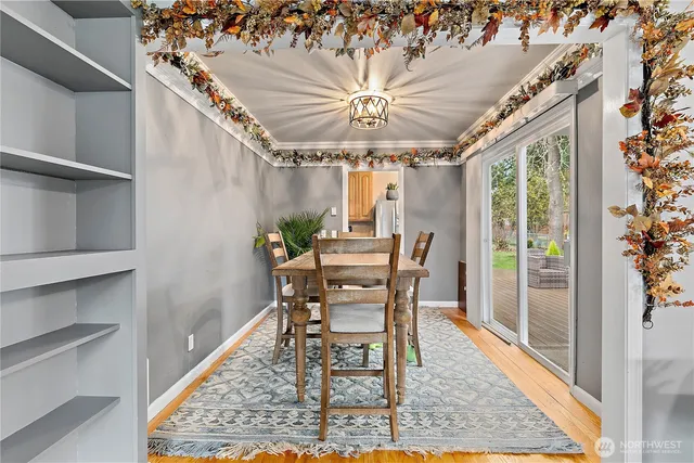 a dining room with furniture and window