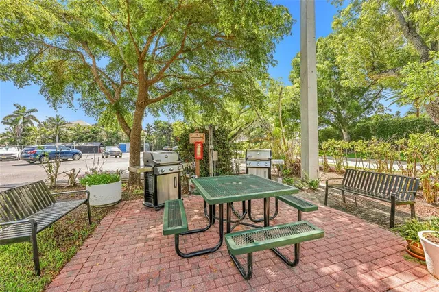 swimming pool view with a seating space