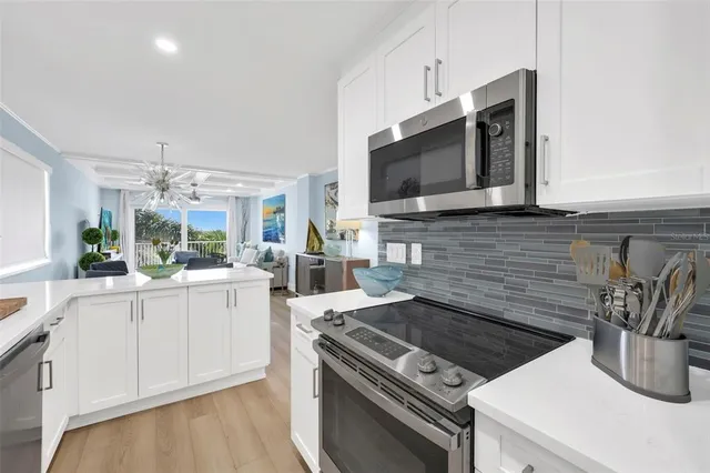 a kitchen with a stove and a microwave