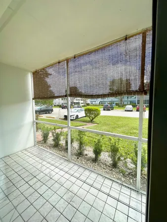 a room that has a bed and a table in it