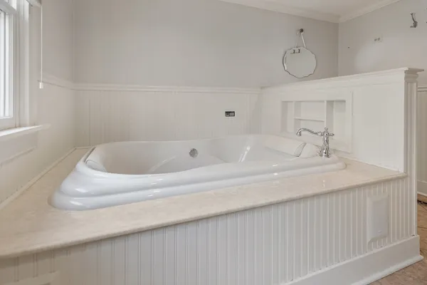 a bathroom with a sink and a window
