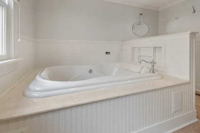 a bathroom with a sink and a window