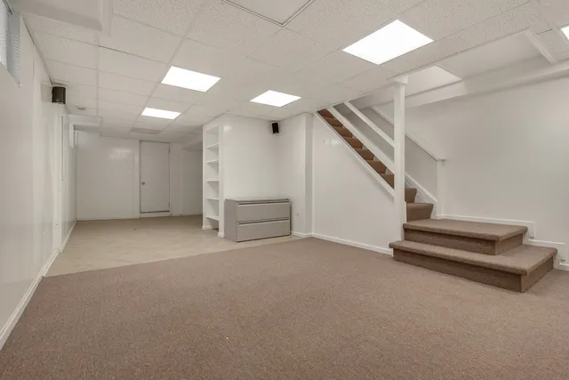 a view of an empty room with stairs