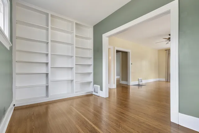 a view of a room with wooden floor and closet