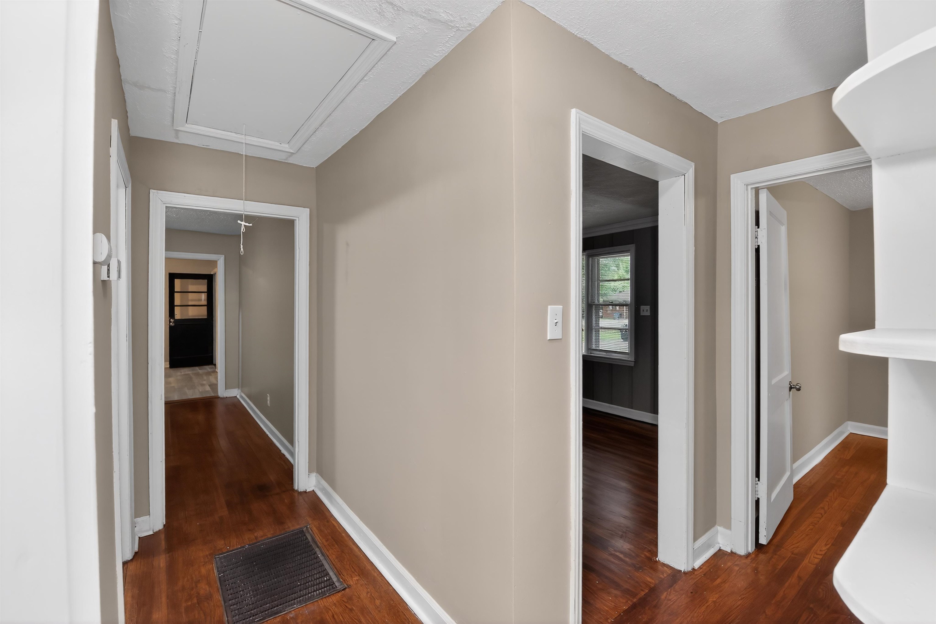 2840 Allen Road Memphis, TN 38128 - Photo 29 of 31 Interior hallway with rich wood-finish flooring and neutral wall tones
