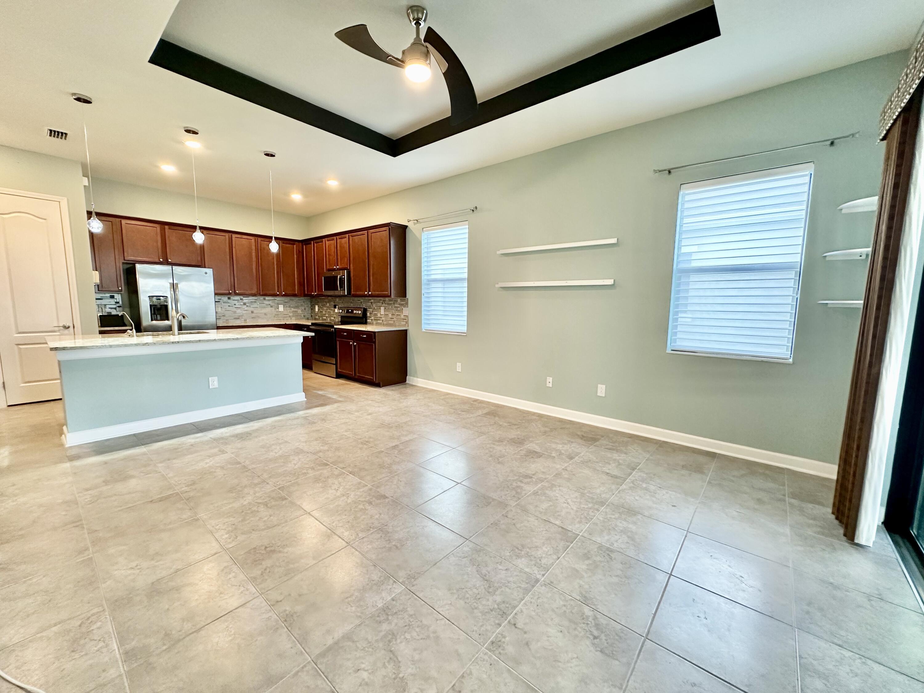 2491 Treasure Cay Lane Melbourne, FL 32940 - Photo 12 of 15 a view of kitchen with refrigerator and window