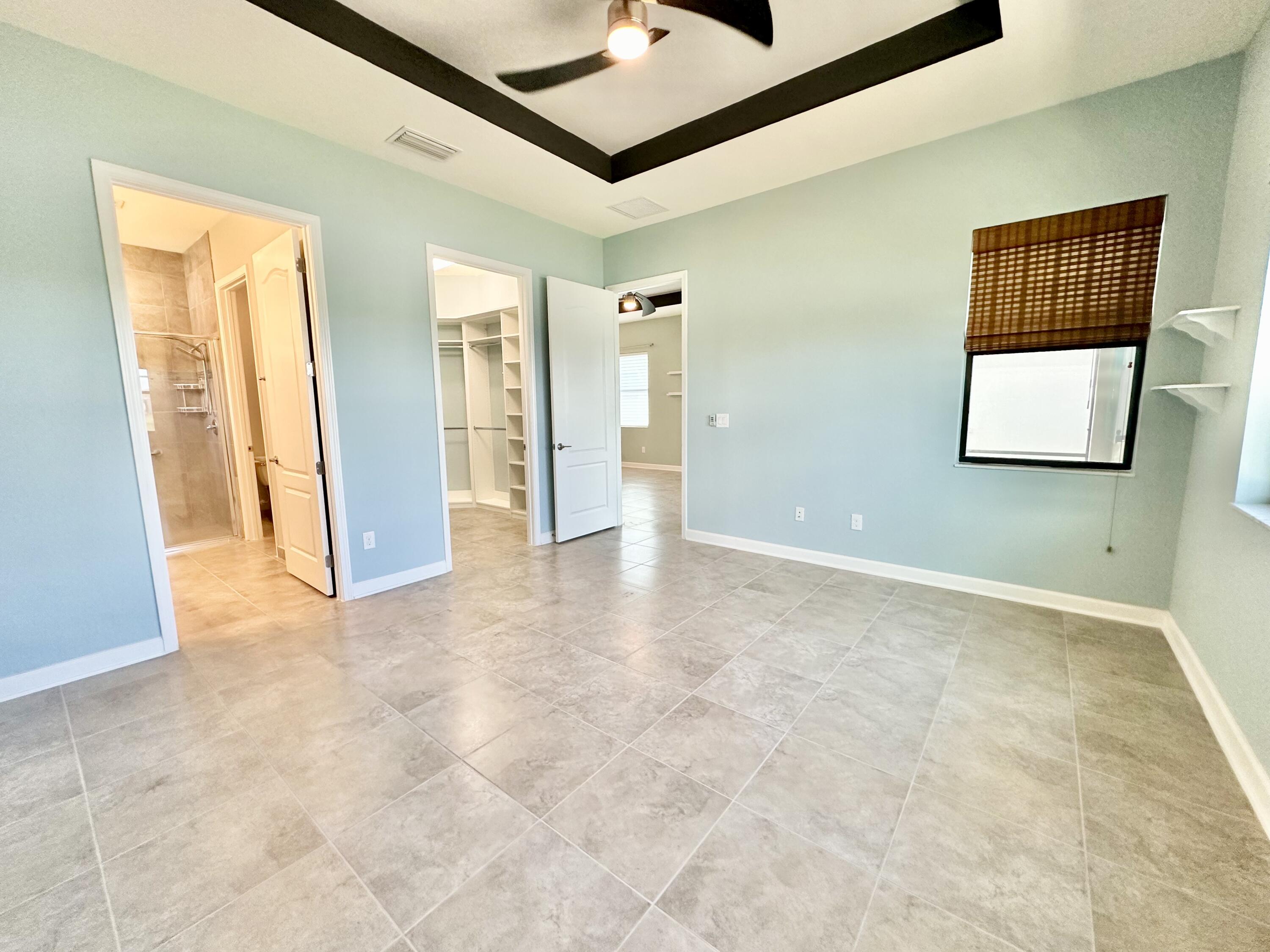 2491 Treasure Cay Lane Melbourne, FL 32940 - Photo 14 of 15 an empty room with windows and closet