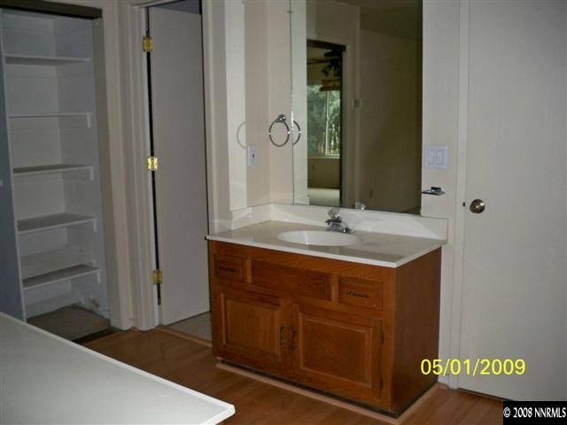 520 West Riverview Circle Reno, NV 89509 - Photo 8 of 9 a bathroom with a sink and a mirror