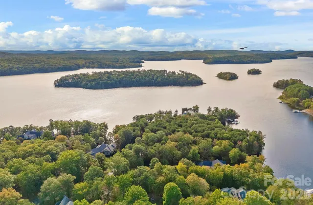 a bed room with a bed and a chair