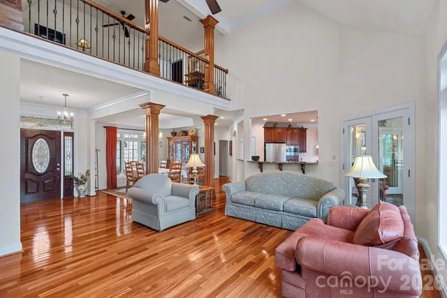 a kitchen with kitchen island granite countertop wooden cabinets and a refrigerator