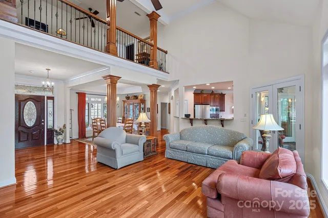 a spacious bathroom with a tub sink and mirror