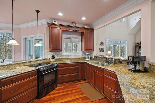 a bathroom with a tub a sink and a window