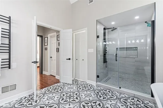 a bathroom with a shower and a sink
