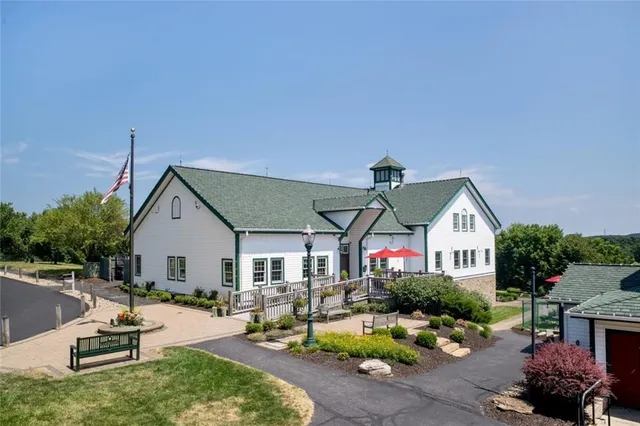 a view of a house with backyard sitting area and garden