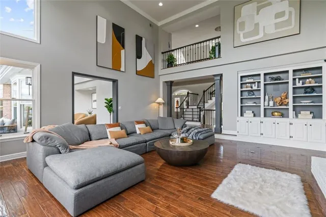 a living room with furniture and a potted plant