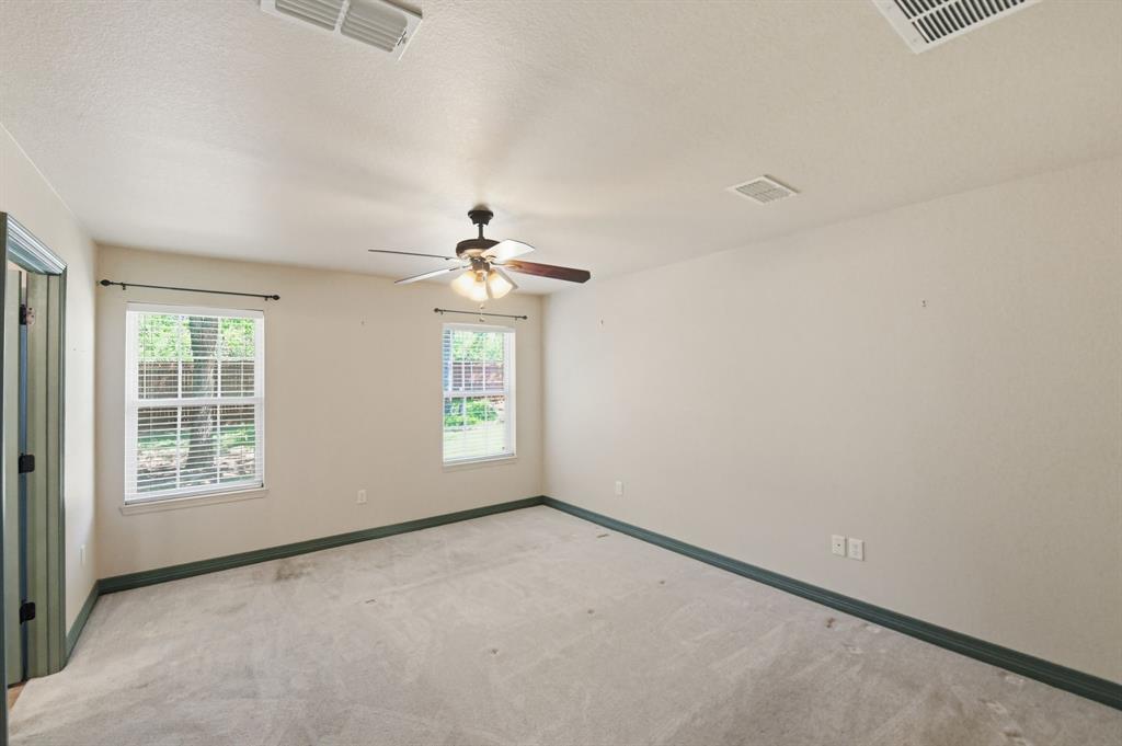 505 Highland Oak Point, TX 75068 - Photo 11 of 38 an empty room with windows