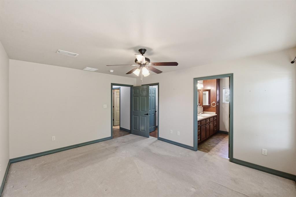 505 Highland Oak Point, TX 75068 - Photo 12 of 38 a view of a livingroom with a ceiling fan