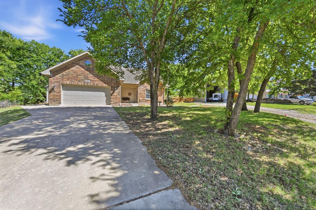 505 Highland Oak Point, TX 75068 - Photo 22 of 38 a backyard of a house with lots of green space