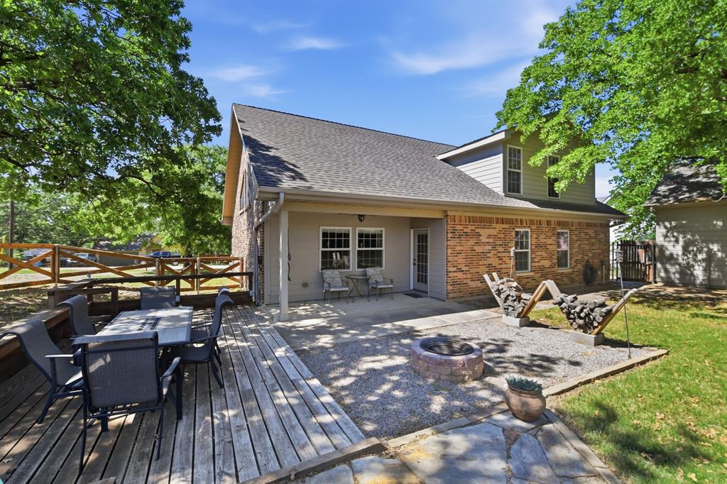 505 Highland Oak Point, TX 75068 - Photo 37 of 38 a view of a backyard with sitting area