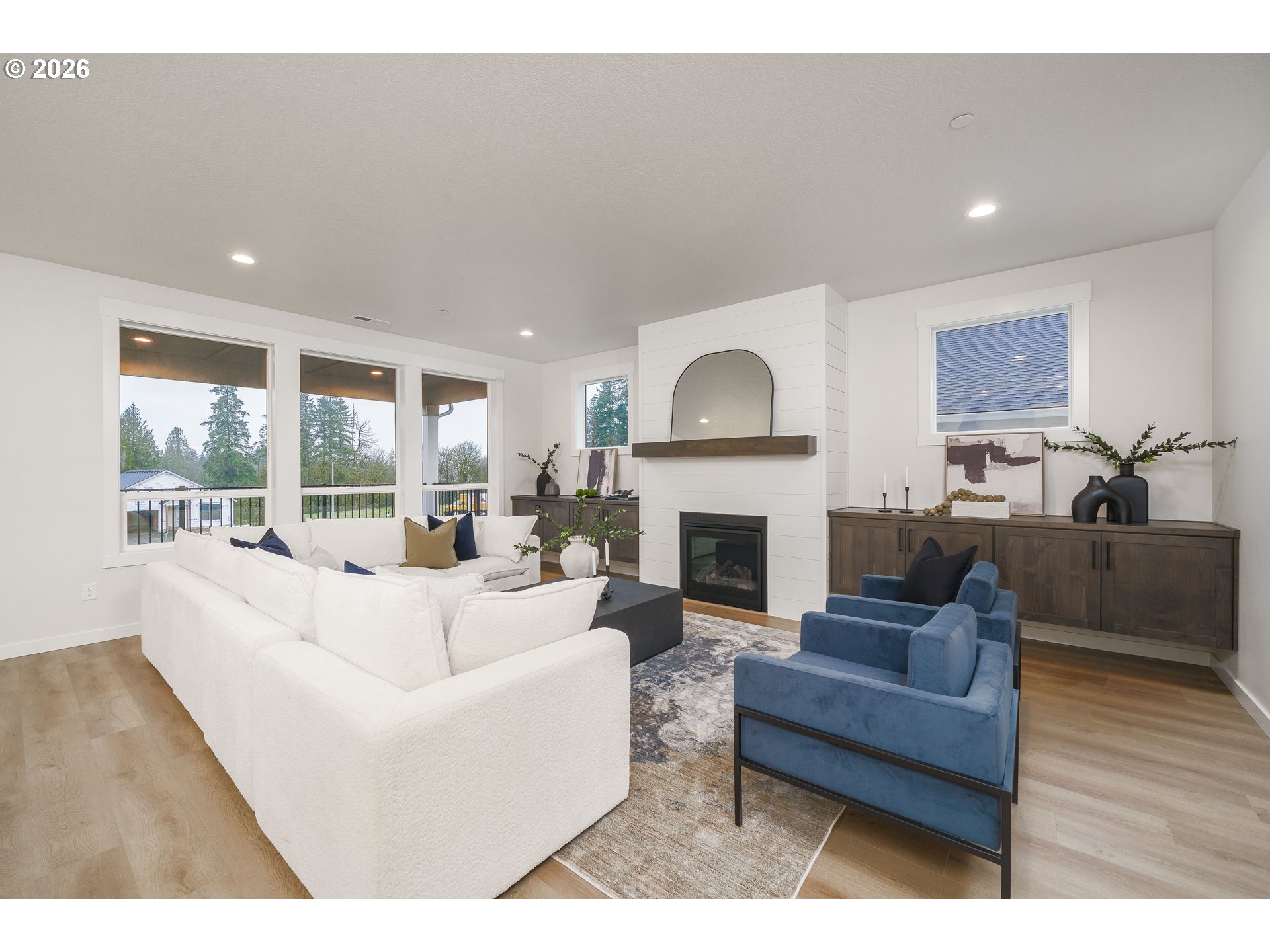 516 West 20th Way La Center, WA 98629 - Photo 16 of 45 a living room with furniture and a fireplace