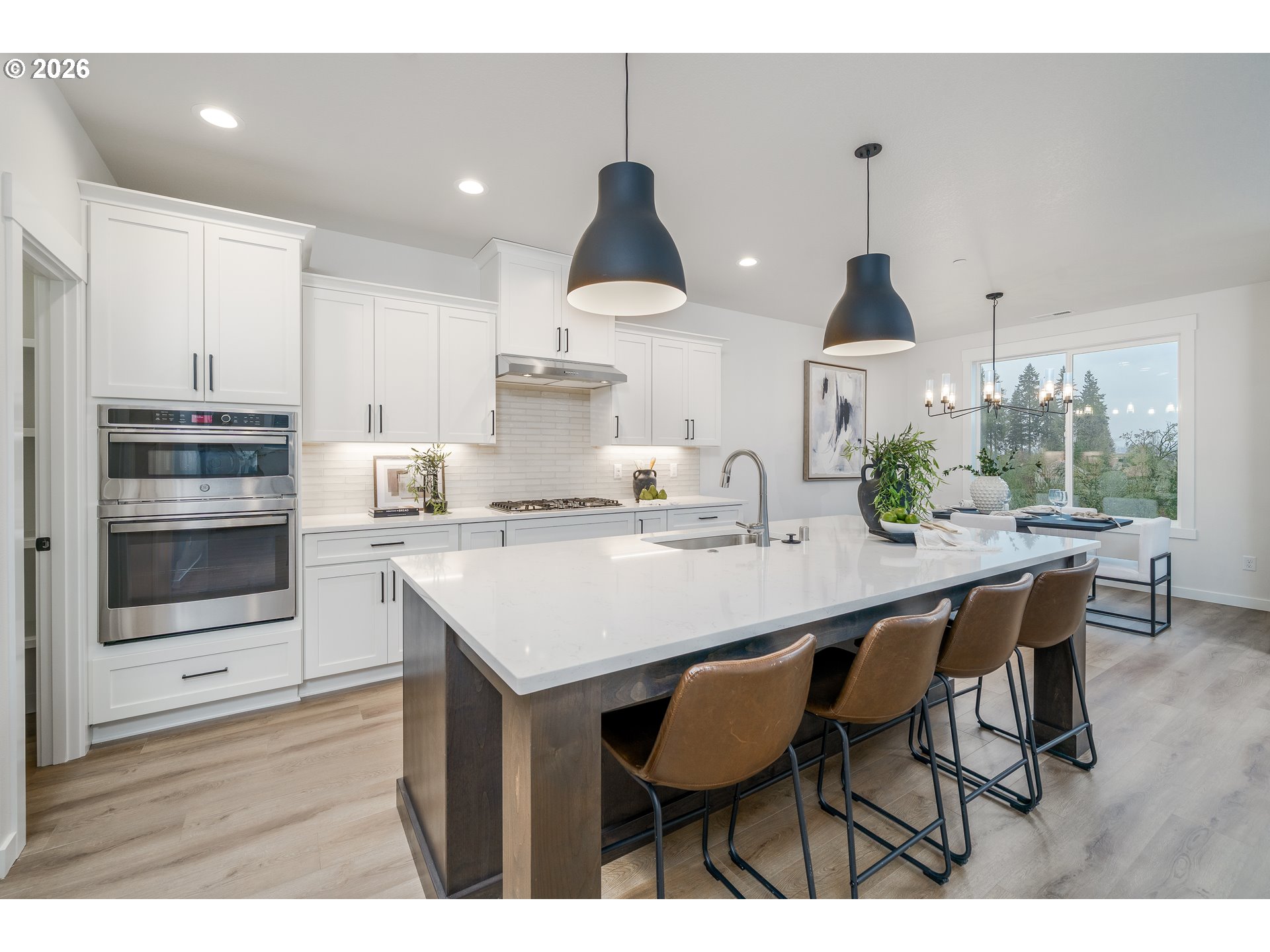 516 West 20th Way La Center, WA 98629 - Photo 21 of 45 a kitchen with a sink cabinets and wooden floor