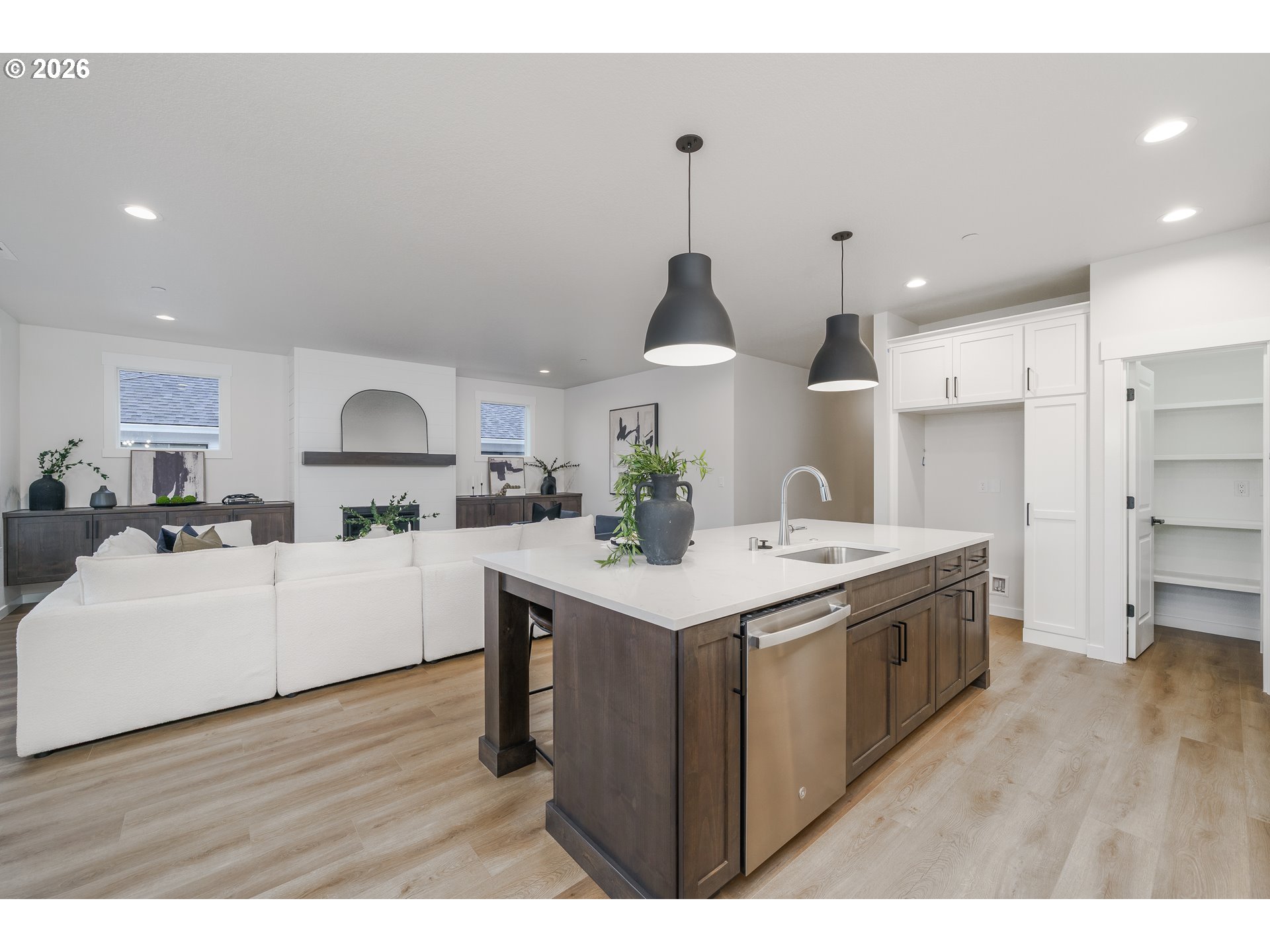 516 West 20th Way La Center, WA 98629 - Photo 22 of 45 a kitchen with stainless steel appliances a sink a stove a refrigerator and white cabinets