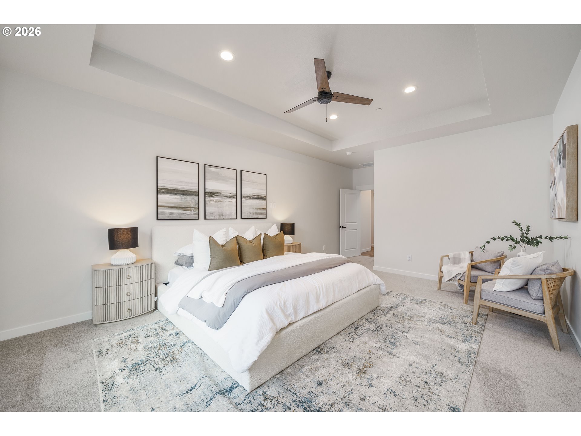 516 West 20th Way La Center, WA 98629 - Photo 31 of 45 a bedroom with a large bed and ceiling fan