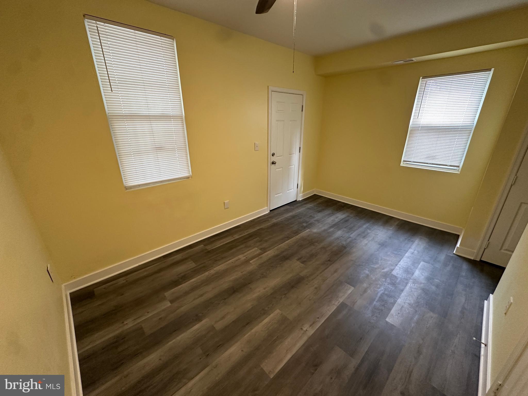 2712 Sherman Avenue Northwest Washington, DC 20001 - Photo 26 of 69 a view of a room with wooden floor and small window