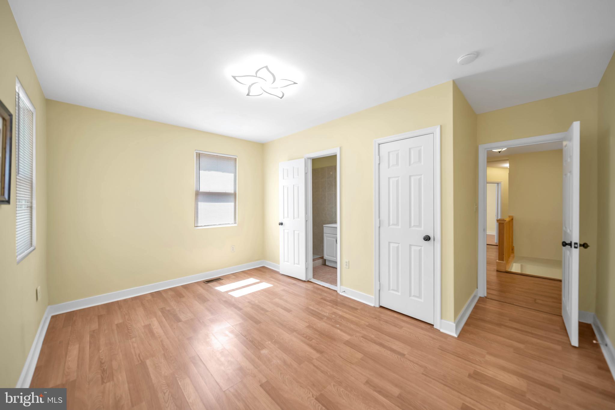 2712 Sherman Avenue Northwest Washington, DC 20001 - Photo 38 of 69 a view of an empty room with wooden floor and a window