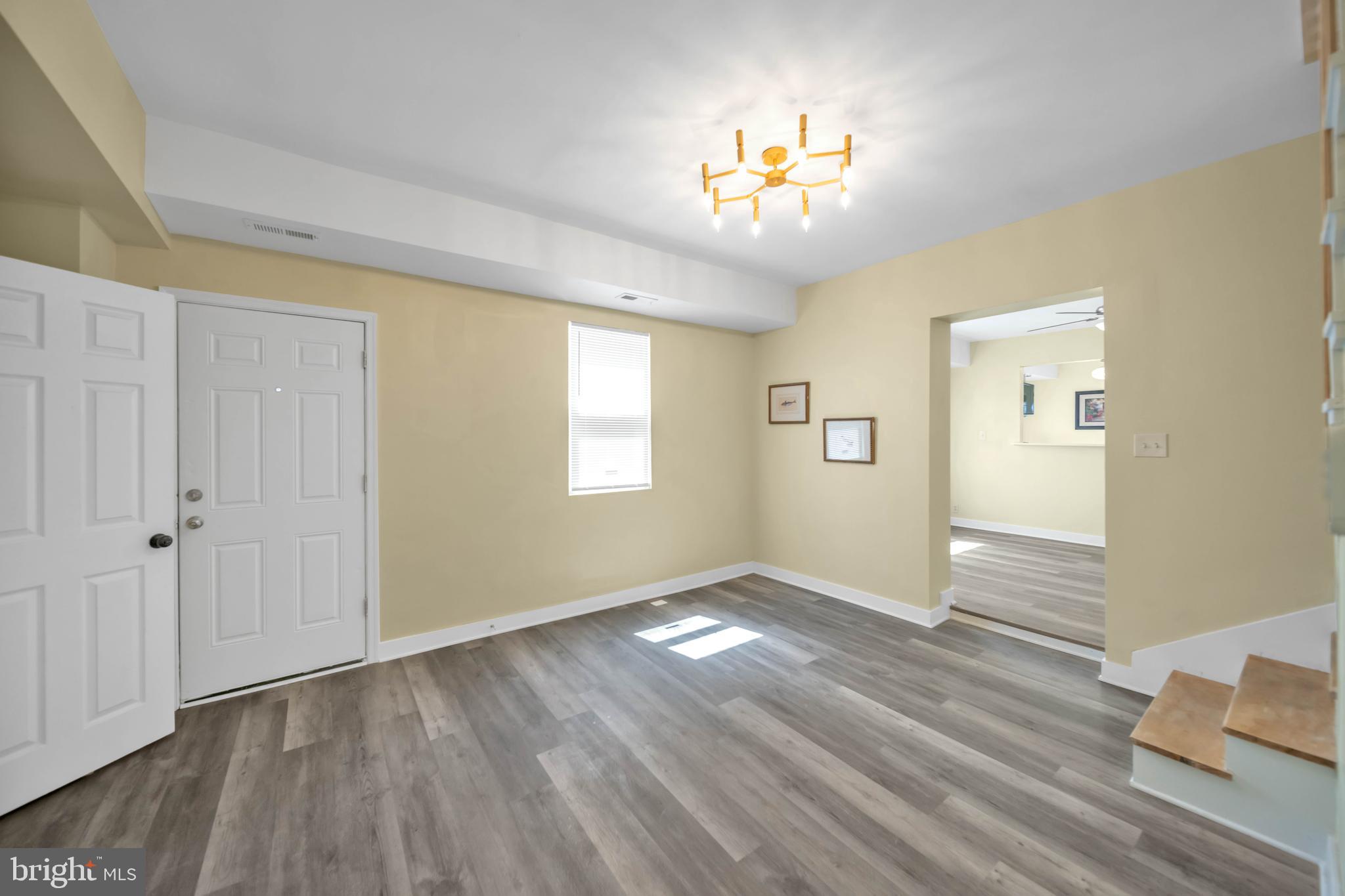 2712 Sherman Avenue Northwest Washington, DC 20001 - Photo 40 of 69 wooden floor in an empty room with a window
